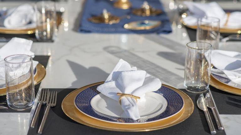 Every place on the table is perfectly invitingly decorated with folded napkin